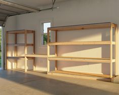 an empty room with wooden shelves in it