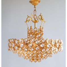 a gold chandelier hanging from the ceiling