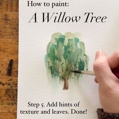 a person is painting a tree with green watercolors on white paper that reads how to paint a willow tree