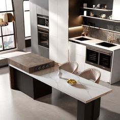 a modern kitchen with marble counter tops and stainless steel appliances