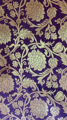 an intricate purple and gold brocade on fabric