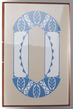 a blue and white design on the side of a door with an oval in the center