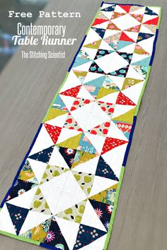 the table runner is made with colorful fabric and has an interesting pattern on it, as well