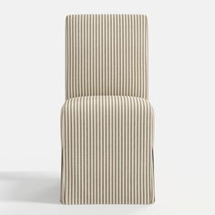 a striped chair sitting on top of a white floor