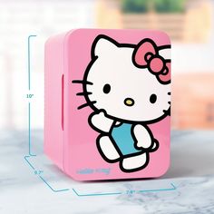 a pink hello kitty lunch box with measurements