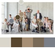 a group of people standing next to each other in front of a wall with different colors