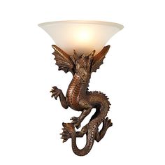 a bronze dragon lamp with a white glass shade on it's head and body