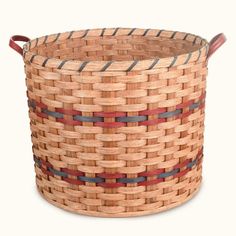 a woven basket with leather handles is shown in this image, it's brown and red