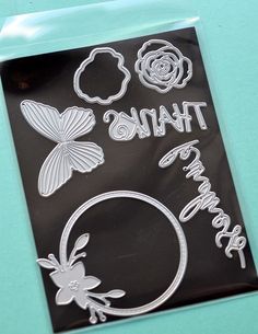 a clear sticker with the words thank you and flowers on it in front of a blue background