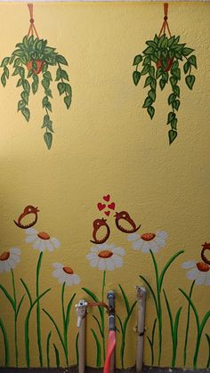 the wall is painted with flowers and birds