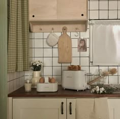 the kitchen counter is clean and ready to be used for cooking or baking, with utensils on it