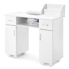 a white computer desk with an open drawer