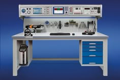 a workbench with various tools and equipment on it's side, against a blue background