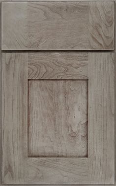 a close up view of an unfinished wood paneled door with a square opening in the center