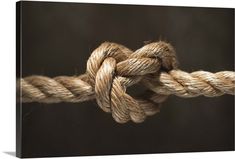 a close up of a rope with some knots on the end and one knot in the middle