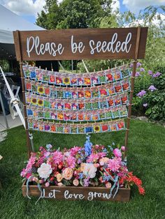 a wooden sign that says please be seeded with flowers in the center and pictures on it