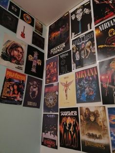 a wall covered in posters and movies