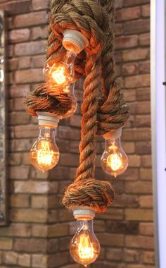 some light bulbs are hanging from a rope