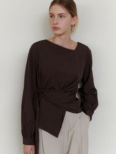 This is a refined and modern blouse by ourcomos that is made out of high quality and sturdy material. With distinctive mood of the design and comfortable wear, you can style it for your stylish and modern daily outfit.- Unbalanced diagonal neckline point- Back zipper for comfortable wear- Luxurious sea shell buttons Fitted Brown Wrap Top, Chic Wrap Blouse For Work, Asymmetrical Blouse For Work In Fall, Fall Asymmetrical Workwear Blouse, Modern Brown Tops For Workwear, Modern Brown Top For Work, Chic Brown Blouse For Work, Chic Brown Workwear Blouse, Elegant Brown Top For Work