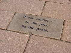 a brick with a poem written on it that says if you cannot't be the poet, be the poem