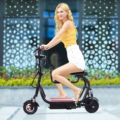 a woman is riding an electric scooter