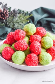 a white plate filled with green and red desserts