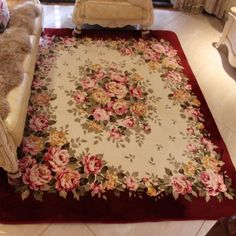 a rug with flowers on it in a living room