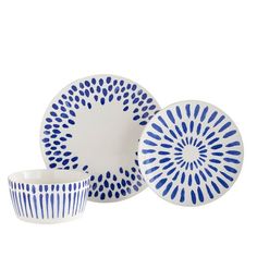 three blue and white dishes on a white background