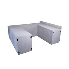 a concrete bench sitting on top of a white floor