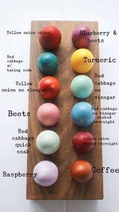 a wooden board with different colored balls on it