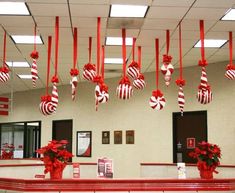 red and white decorations hanging from the ceiling