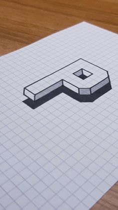 a piece of paper with a drawing of a square object in the middle on top of it