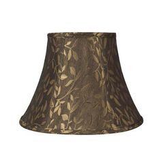 a brown lamp shade with leaves on it