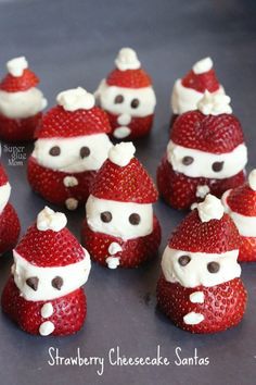 some strawberries with santa clause on them are sitting in the shape of santa claus