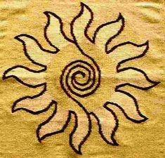 an embroidered sunflower on a yellow background