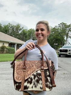 Every hide is different ❤️ if you want to see pictures let me know!  Strap Included 16."x12.5"x5" Hand tooled leather Tote Bag with floral design on the front. Perfect for work, travel and everyday use. This purse will last a lifetime. Designed for the fun loving and free spirited. 1. This tote bag mainly opens with zip closure. 2. In this bag inside there is one single compartment along with one side zipper pocket and one open pocket on the other side of it is given 3.In this bag backside one z Brown Laptop Bag With Laptop Sleeve, Western Office, Concealed Carry Bags, Western Purses, Bag Inside, Floral Bags, Leather Laptop Bag, Hand Tooled Leather, Cow Girl