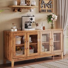 a wooden cabinet with glass doors and shelves on the wall next to a potted plant