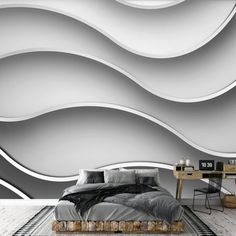 a bed sitting in front of a white wall with wavy lines on it's sides