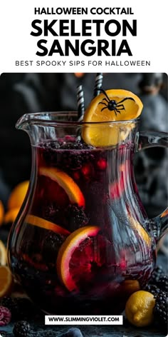 a glass pitcher filled with halloween sangria