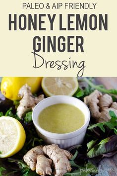 honey lemon ginger dressing with fresh herbs and sliced lemons