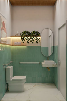 a green tiled bathroom with a toilet, sink and mirror