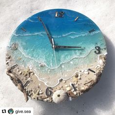 a clock that is sitting on the sand