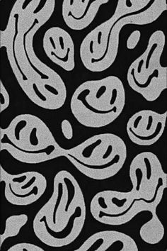 an abstract black and white pattern with swirls in the middle, on a black background