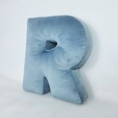 a blue pillow shaped like the letter p