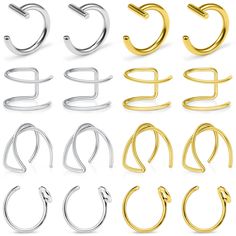 several different types of earrings on white background