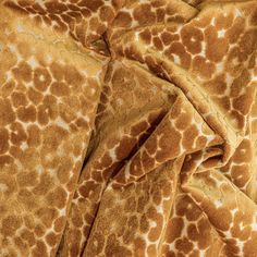 a brown and white animal print fabric