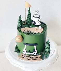 a green cake with golf themed decorations on it