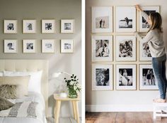 a woman hanging pictures on the wall next to a bed