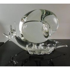 a glass object sitting on top of a table