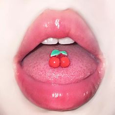 a close up of a person's mouth with pink lipstick and cherries on it